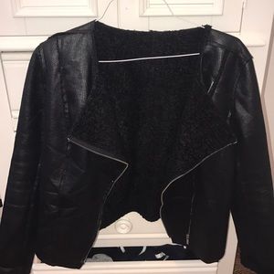 Black leather jacket lined with fur. Reversible